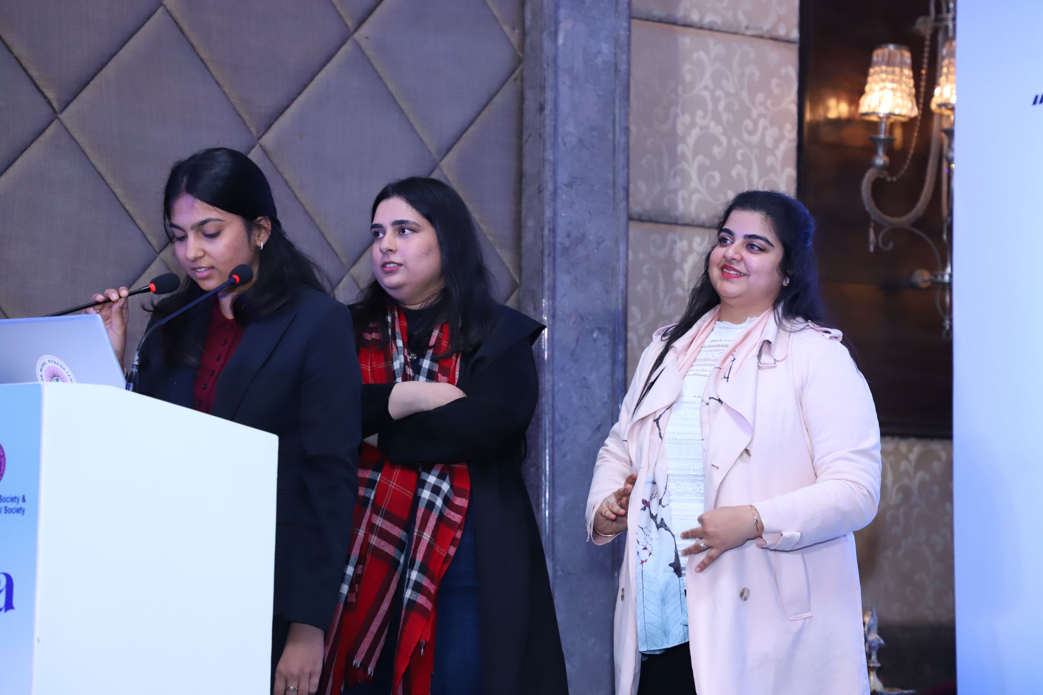 Soumya Goel presenting on stage at the Founders' Day event
